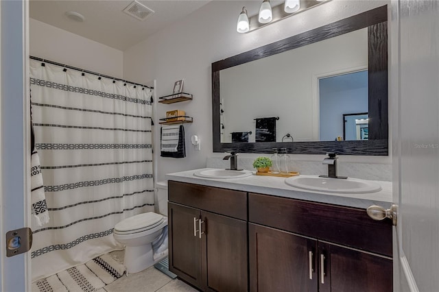 bathroom featuring tile patterned floors, vanity, toilet, and a shower with shower curtain