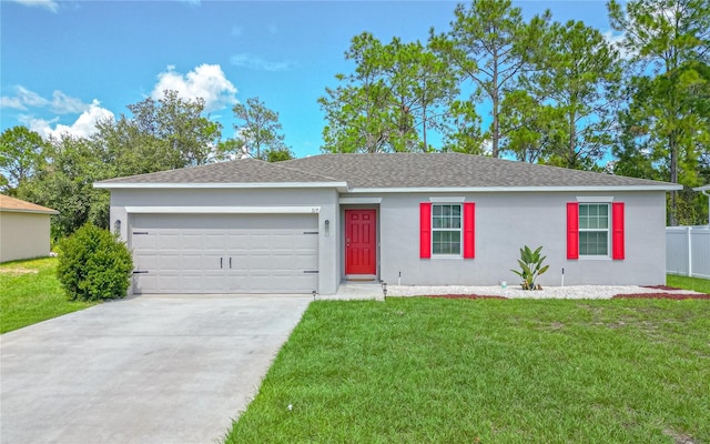 ranch-style house featuring a garage and a front yard