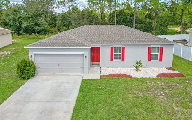 single story home featuring a front yard and a garage