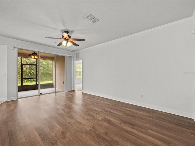 unfurnished room featuring ornamental molding, a textured ceiling, and dark wood-type flooring