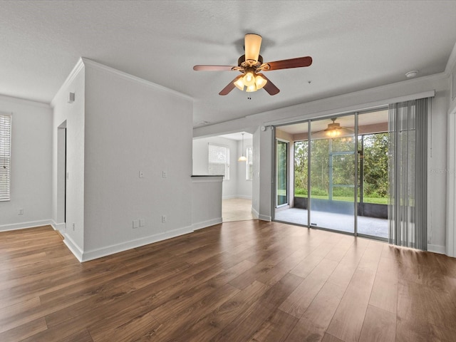 unfurnished living room featuring wood-type flooring, a textured ceiling, ceiling fan, and crown molding