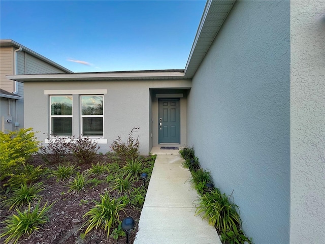 1393 Asher Mason Ave, Kissimmee, FL 34744 - doorway to property featuring stucco siding