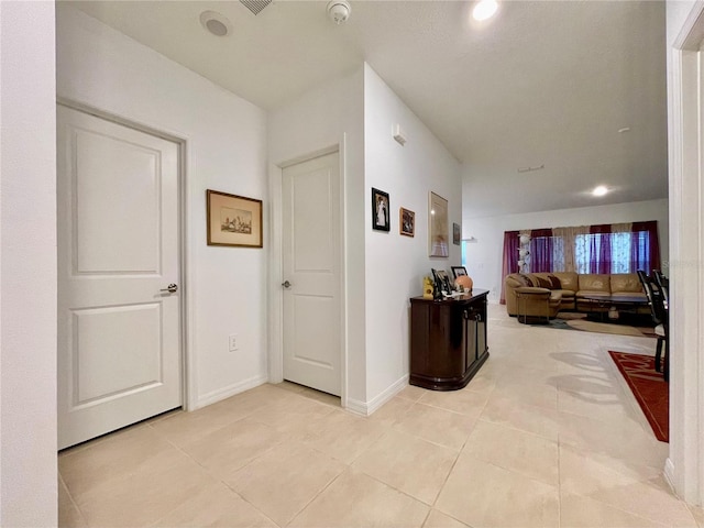 hallway with light tile patterned floors