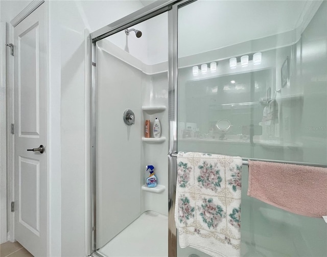 bathroom with a shower with shower door