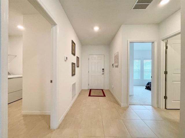 1393 Asher Mason Ave, Kissimmee, FL 34744 - corridor with light tile patterned floors, washer / dryer, recessed lighting, and baseboards