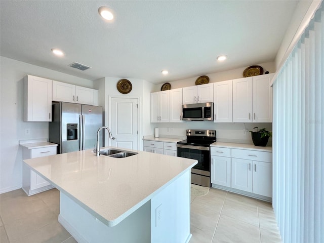 1393 Asher Mason Ave, Kissimmee, FL 34744 - kitchen with appliances with stainless steel finishes, a sink, white cabinets, light countertops, and recessed lighting
