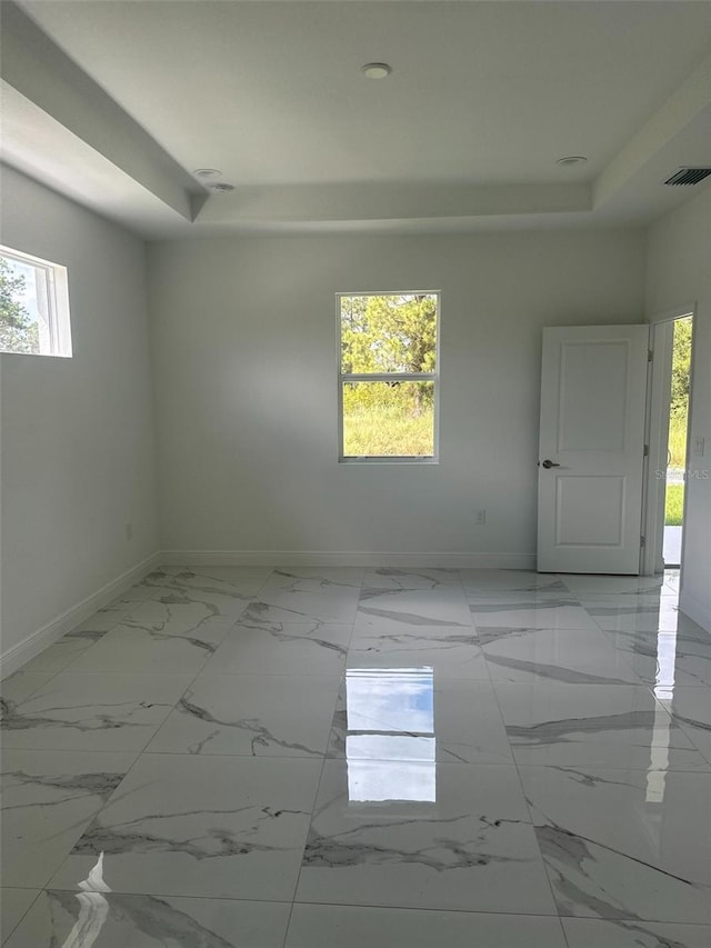 empty room featuring plenty of natural light