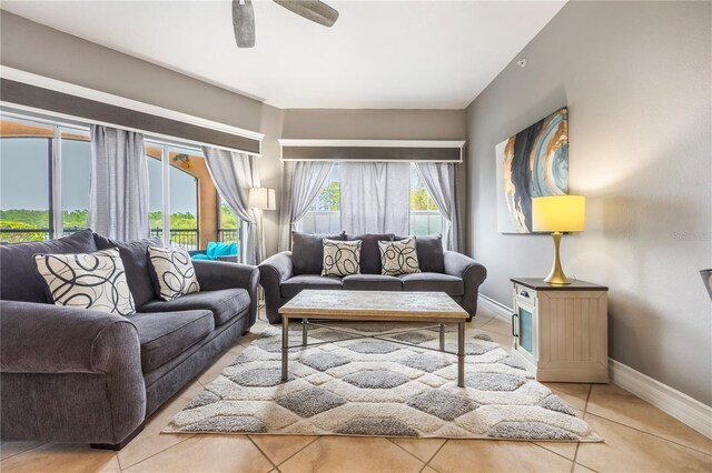 living room featuring tile patterned floors and ceiling fan