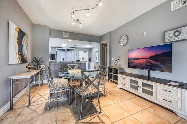 dining space with visible vents and light tile patterned floors