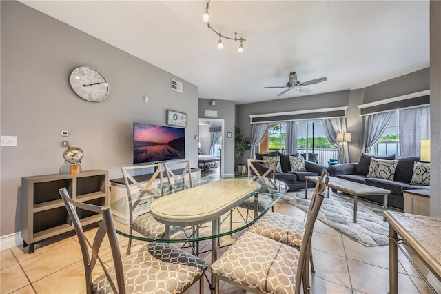 living room featuring ceiling fan and light tile patterned flooring