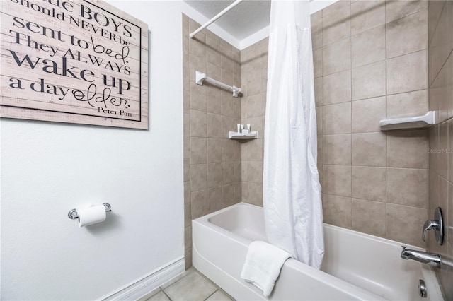 bathroom featuring shower / bath combination with curtain, baseboards, and tile patterned flooring