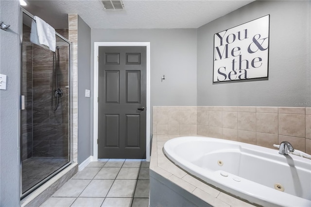 full bathroom with a shower stall, tile patterned flooring, a jetted tub, visible vents, and a textured ceiling