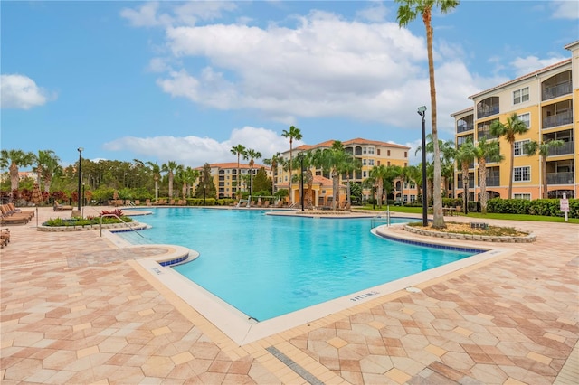 view of swimming pool featuring a patio