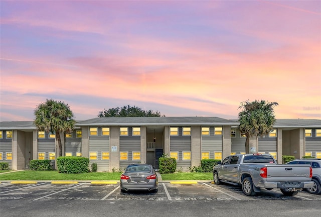 view of outdoor building at dusk