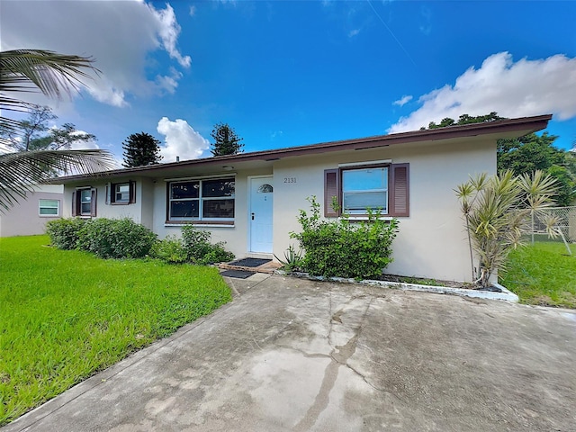 ranch-style home with a front yard