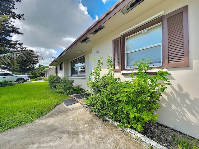 view of home's exterior with a lawn