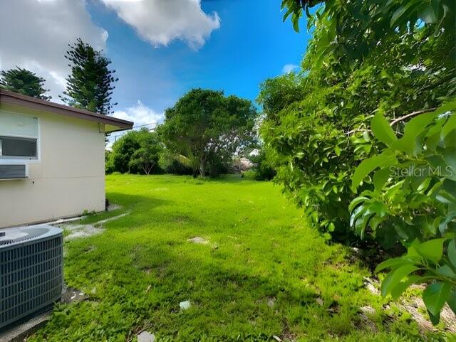 view of yard with central AC unit