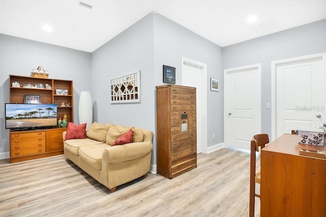 593 Lake Wildmere Cv, Longwood, FL 32750 - living room with light wood-style floors and baseboards