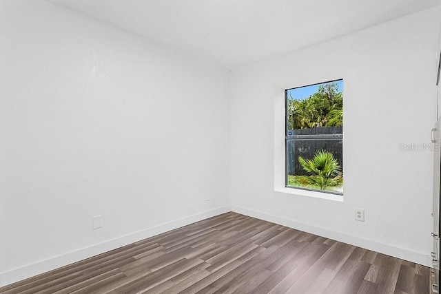 spare room featuring hardwood / wood-style flooring