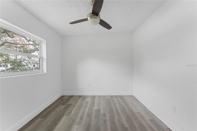 spare room featuring ceiling fan, wood-type flooring, and a textured ceiling