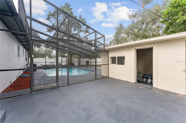 view of pool featuring a patio and a lanai