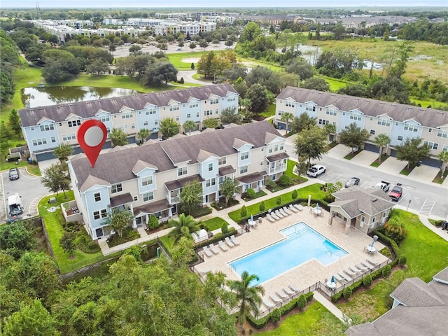 594 Piazza Pt, Oviedo, FL 32765 - drone / aerial view of a pool area and a large body of water