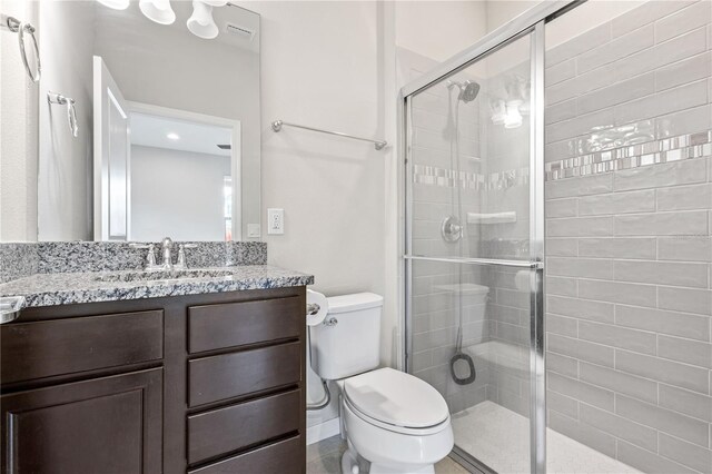594 Piazza Pt, Oviedo, FL 32765 - bathroom with a stall shower, toilet, and vanity