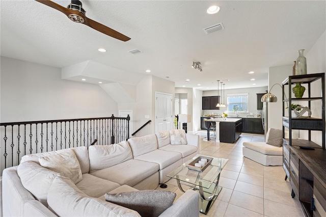 594 Piazza Pt, Oviedo, FL 32765 - living room featuring a ceiling fan, light tile patterned floors, and recessed lighting