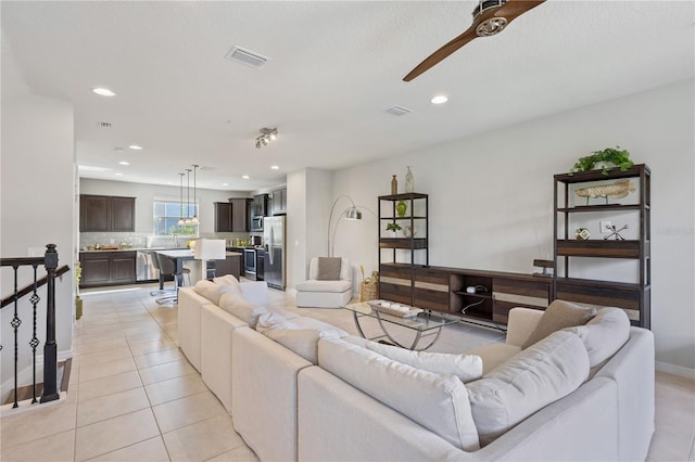 594 Piazza Pt, Oviedo, FL 32765 - living area featuring light tile patterned flooring, recessed lighting, ceiling fan, and baseboards
