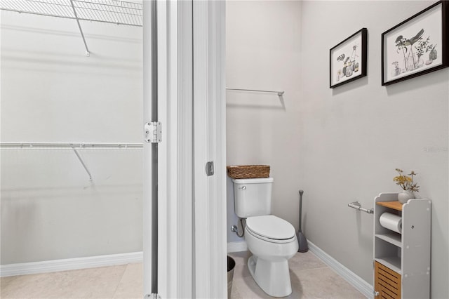 bathroom featuring tile patterned flooring and toilet