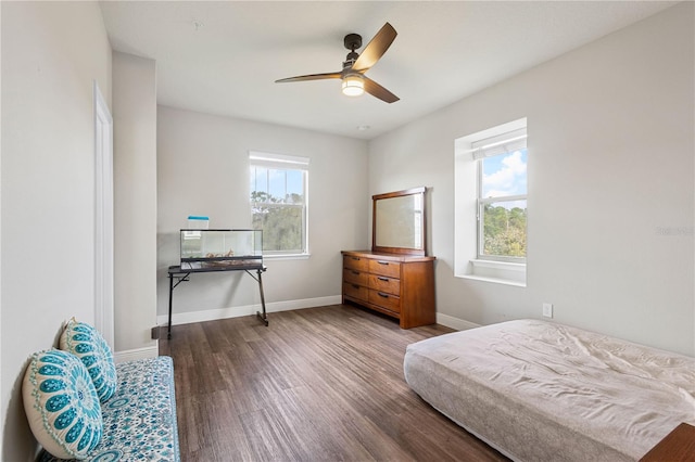 594 Piazza Pt, Oviedo, FL 32765 - bedroom featuring wood finished floors, baseboards, and a ceiling fan