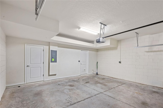 594 Piazza Pt, Oviedo, FL 32765 - garage with a garage door opener, electric panel, and concrete block wall