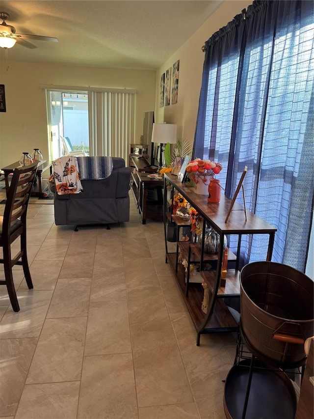 dining room with light tile patterned floors and ceiling fan