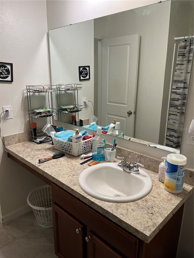 bathroom with vanity and tile patterned flooring