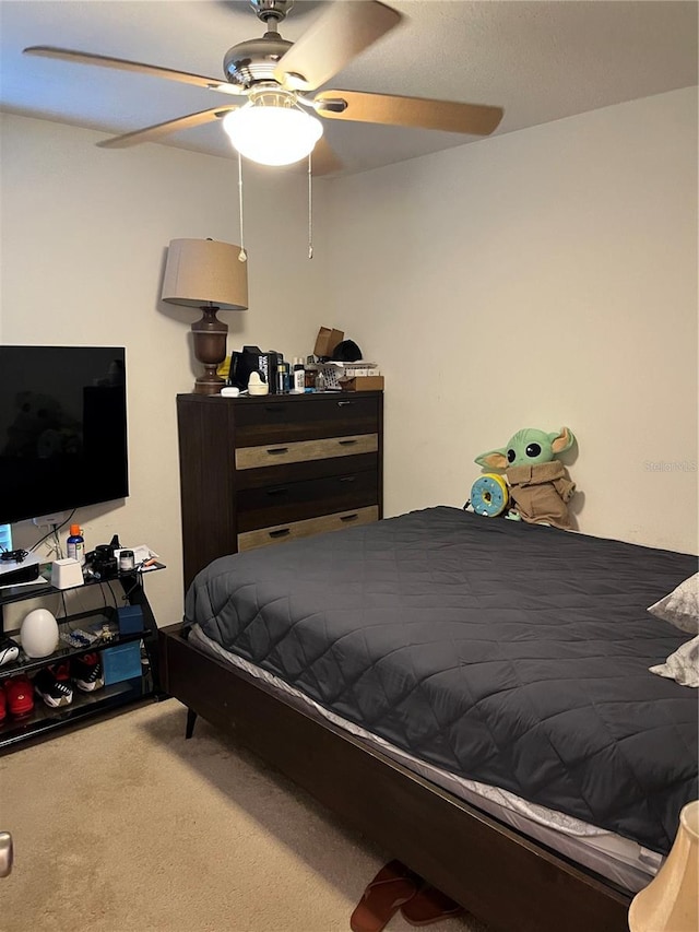 bedroom featuring ceiling fan and carpet floors