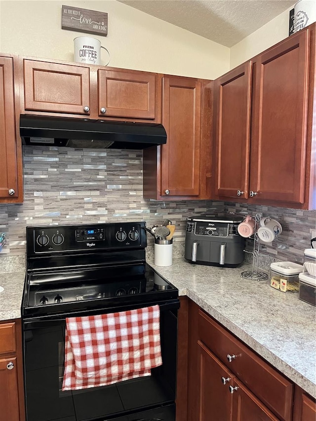 kitchen featuring black electric range oven and decorative backsplash