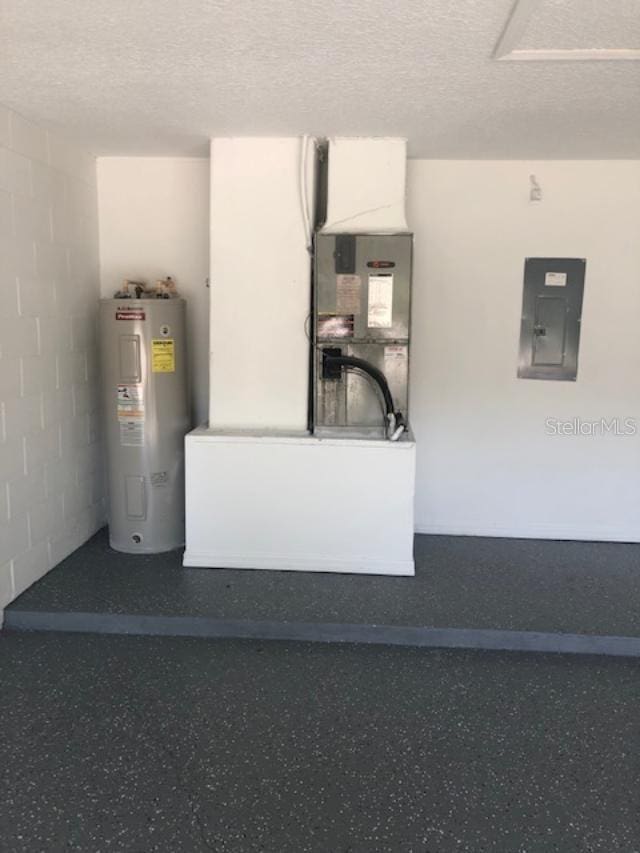 interior space with electric water heater and electric panel