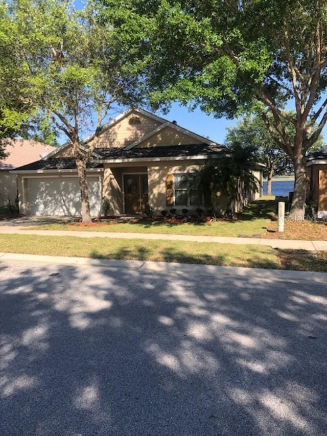 single story home featuring a garage