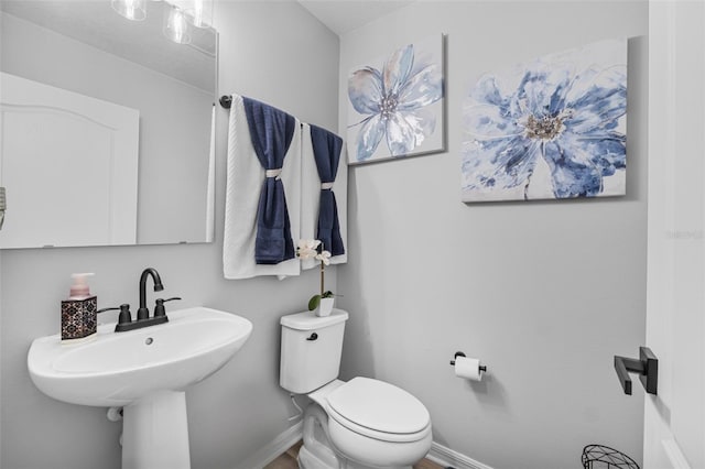 bathroom featuring sink and toilet