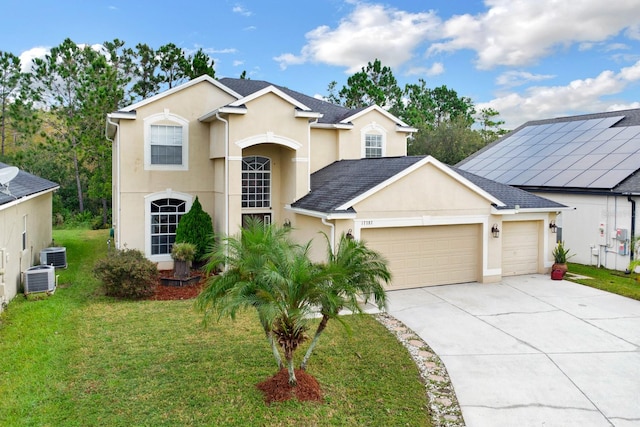 view of front of house featuring a front lawn, central air condition unit, and a garage