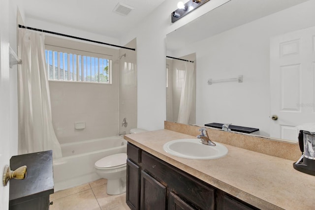 full bathroom with vanity, tile patterned floors, toilet, and shower / tub combo