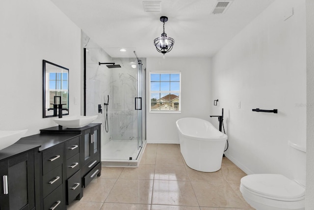 full bathroom featuring tile patterned flooring, vanity, toilet, and independent shower and bath