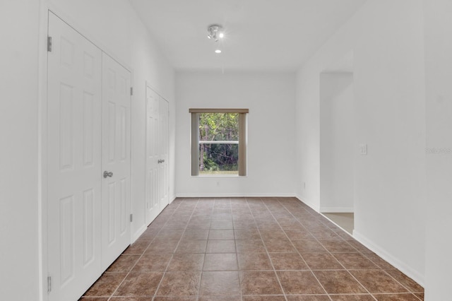 spare room with tile patterned flooring