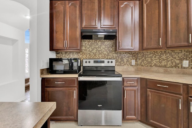 kitchen with stainless steel range with electric stovetop and backsplash