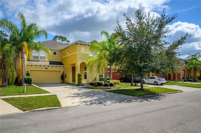 view of front facade featuring a garage and a front yard