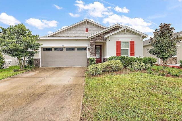 craftsman-style home with a front lawn and a garage