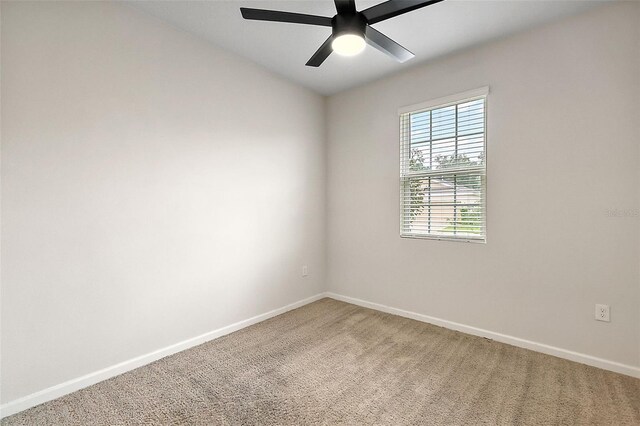 carpeted empty room with ceiling fan