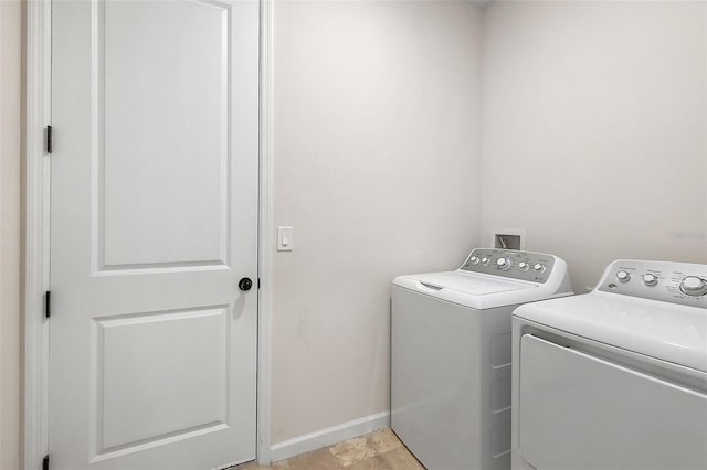 clothes washing area featuring independent washer and dryer