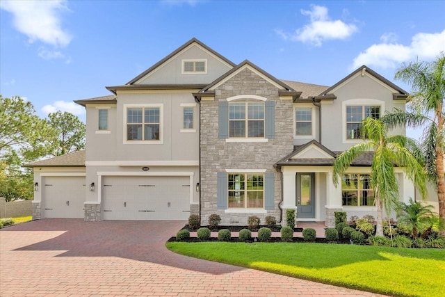 view of front of home featuring a garage and a front yard