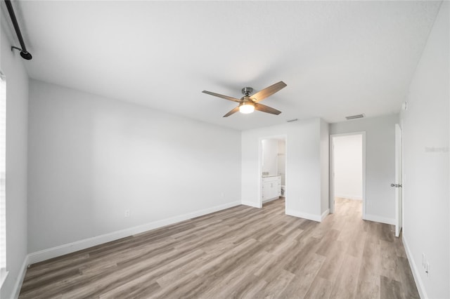 unfurnished room featuring light hardwood / wood-style flooring and ceiling fan